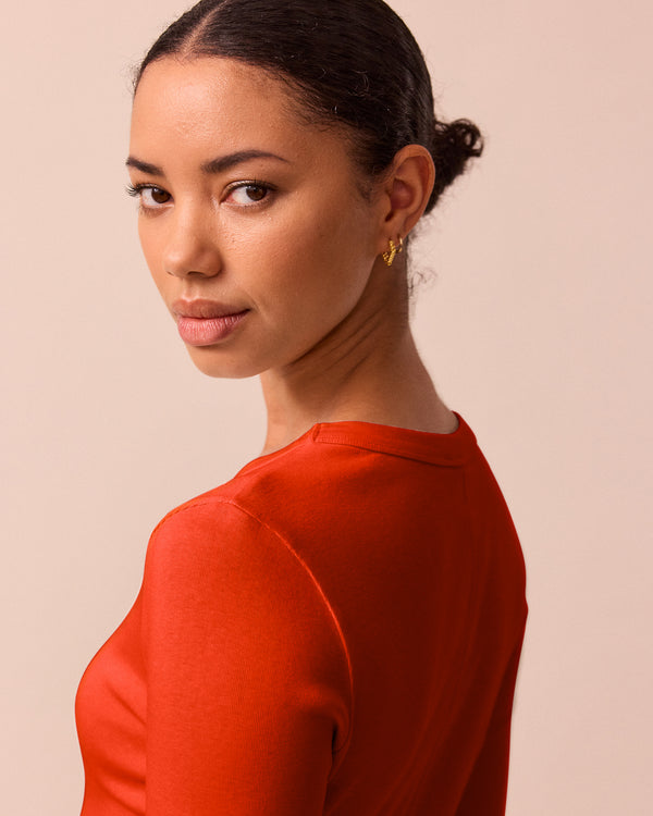 model wears lila red jersey top