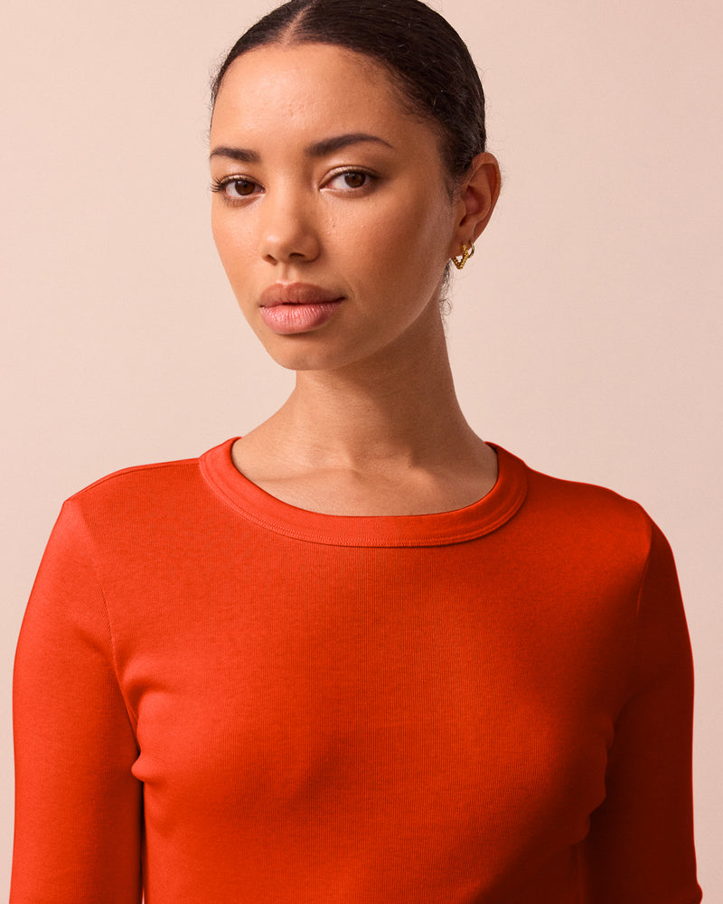 model wears lila red jersey top