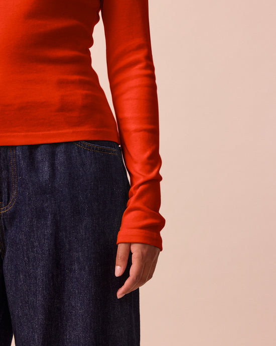 model wears lila red jersey top