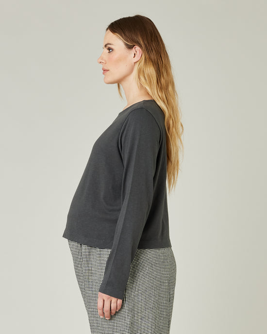 pregnant model wears slate boat neck top