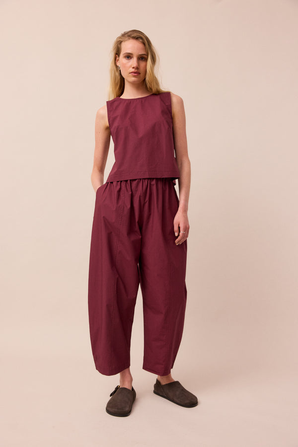 model wears esme burgundy poplin top