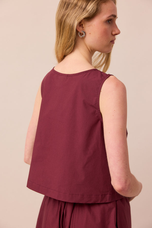 model wears esme burgundy poplin top