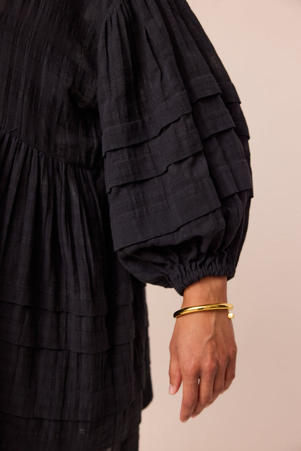 model wears black nina smock dress 