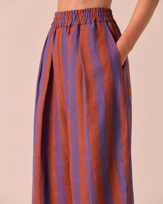 model wears bobbi terracotta stripe linen trousers right