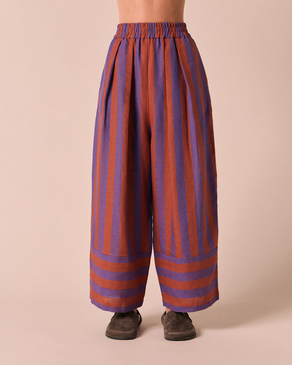 model wears bobbi terracotta stripe linen trousers front