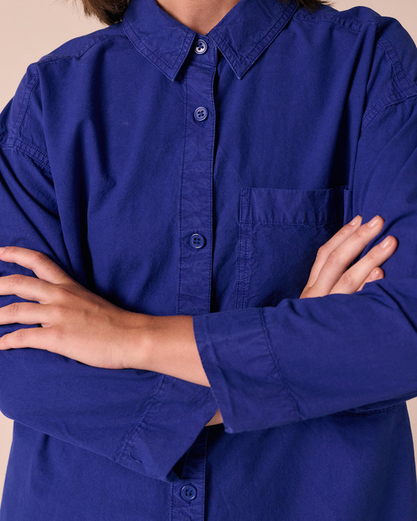 model wears edith klein blue cotton popolin shirt