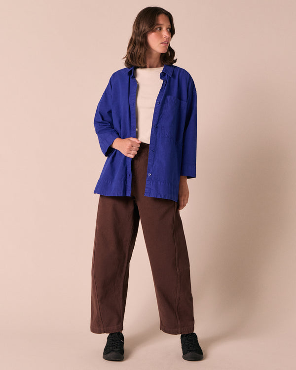 model wears edith klein blue cotton popolin shirt
