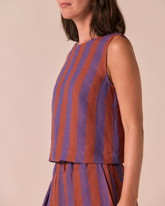 model wears esme terracotta stripe linen top