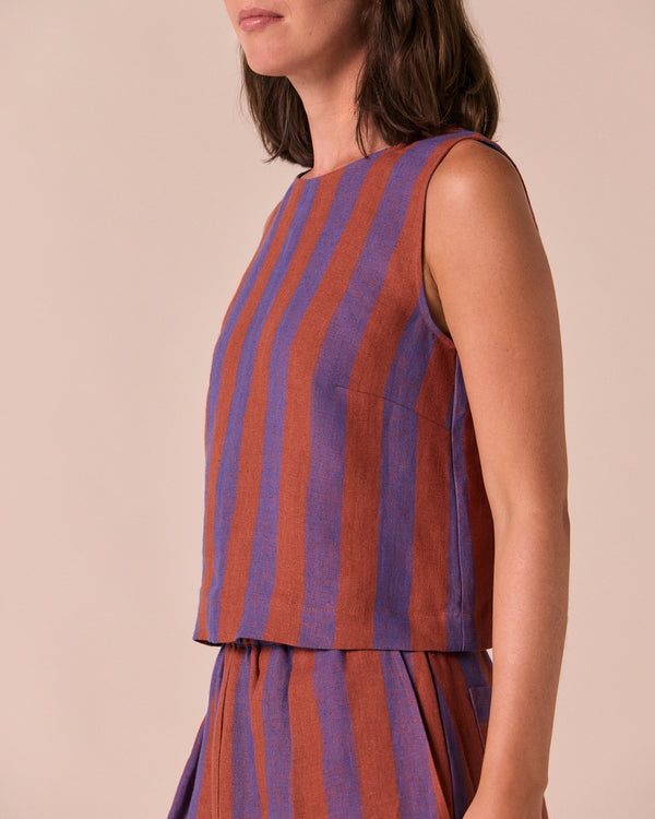 model wears esme terracotta stripe linen top