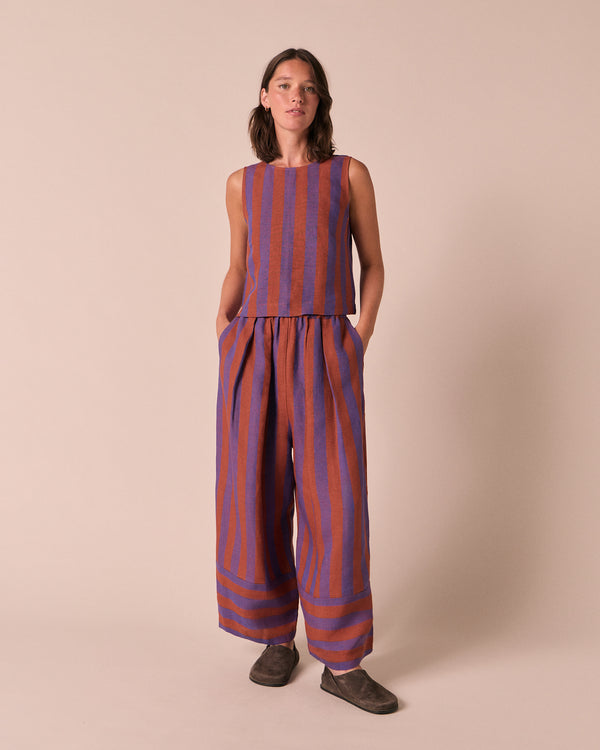 model wears esme terracotta stripe linen top