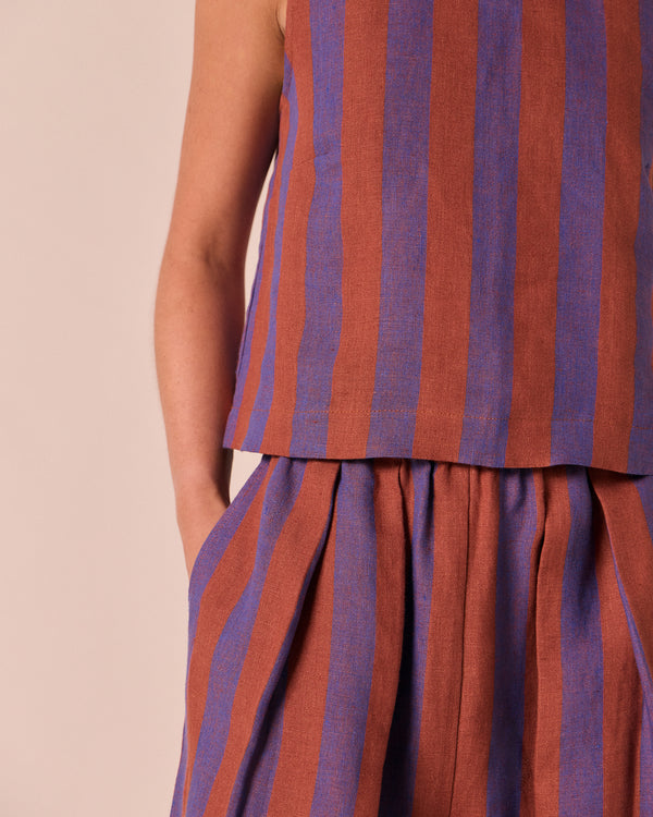 model wears esme terracotta stripe linen top