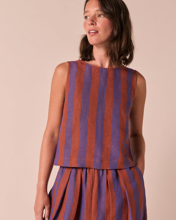 model wears esme terracotta stripe linen top