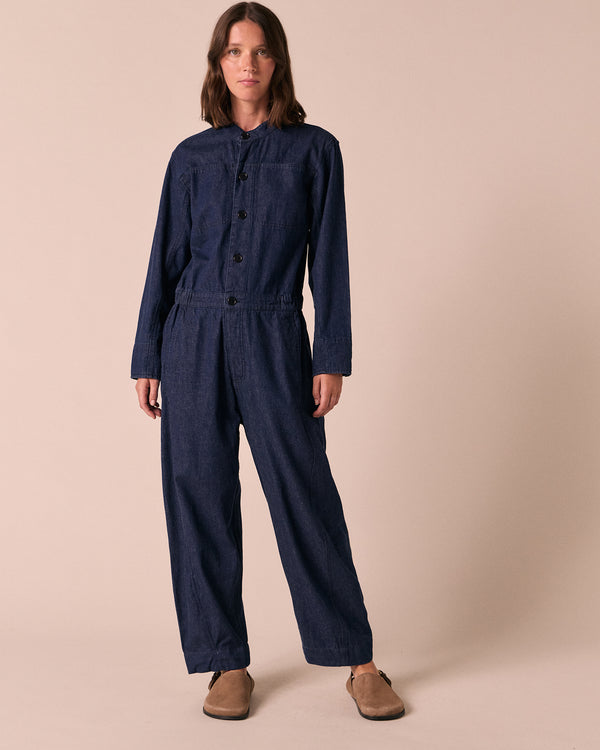 model wears jill dark wash denim jumpsuit