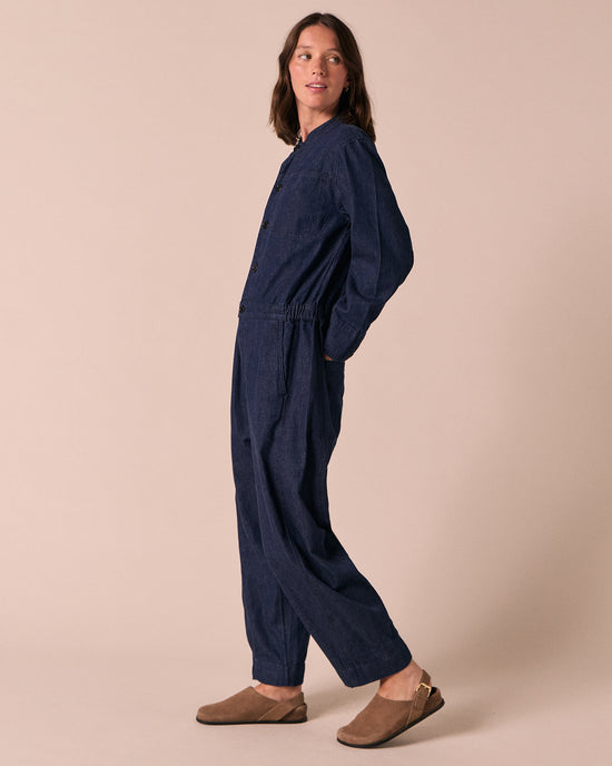 model wears jill dark wash denim jumpsuit