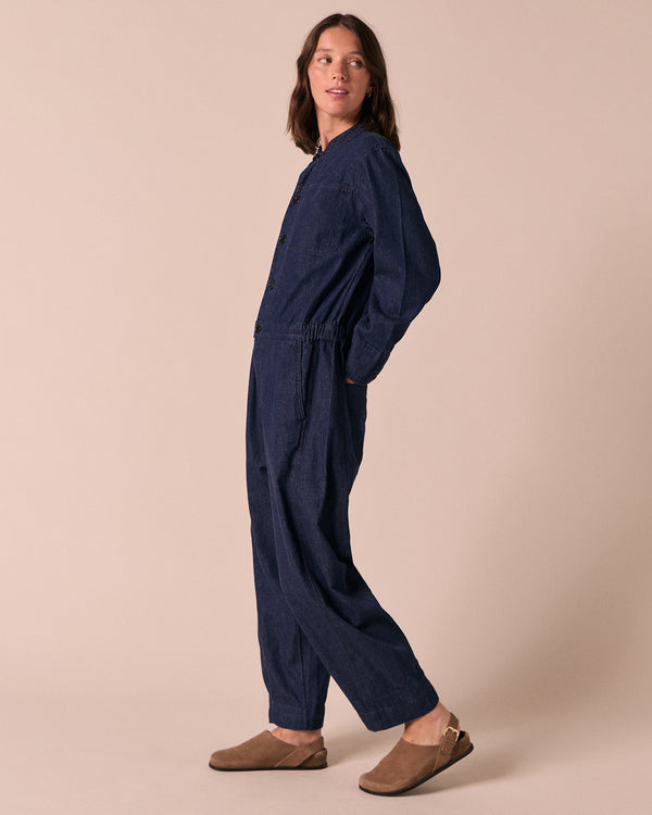 model wears jill dark wash denim jumpsuit
