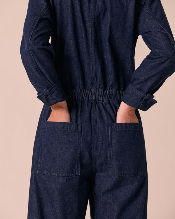 model wears jill dark wash denim jumpsuit