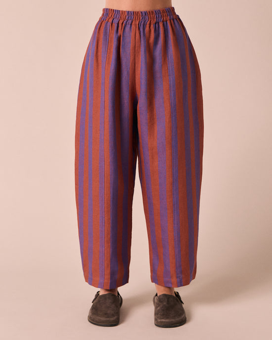 model wears mabel terracotta stripe linen trousers front