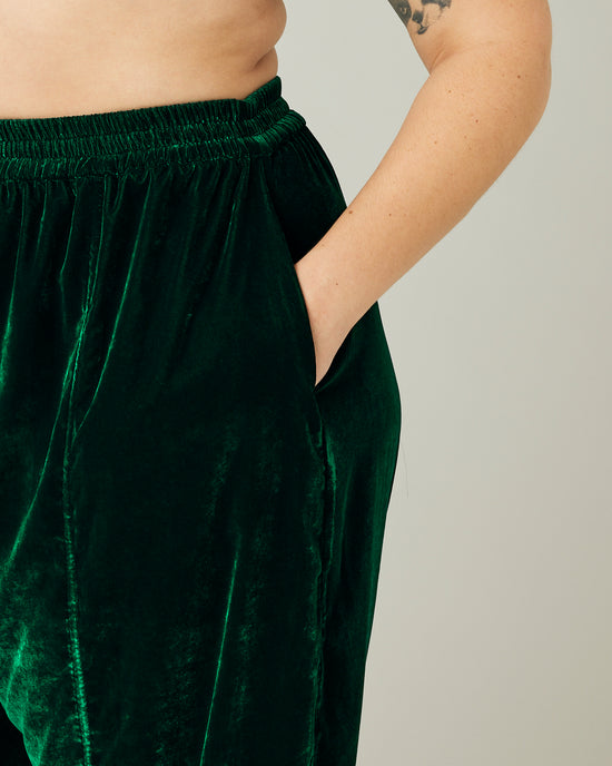 model wears green velvet mabel trousers