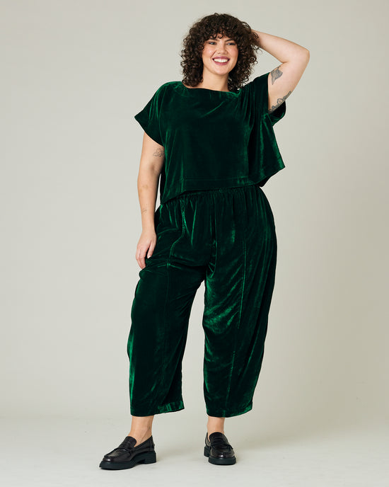 model wears green velvet polly top and mabel trousers