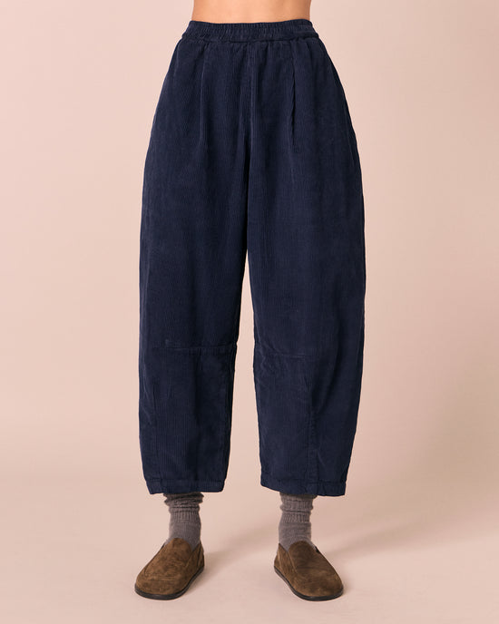 model wears daisy navy cord trousers front