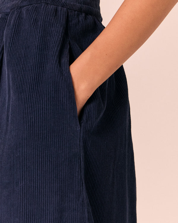model wears daisy navy cord trousers