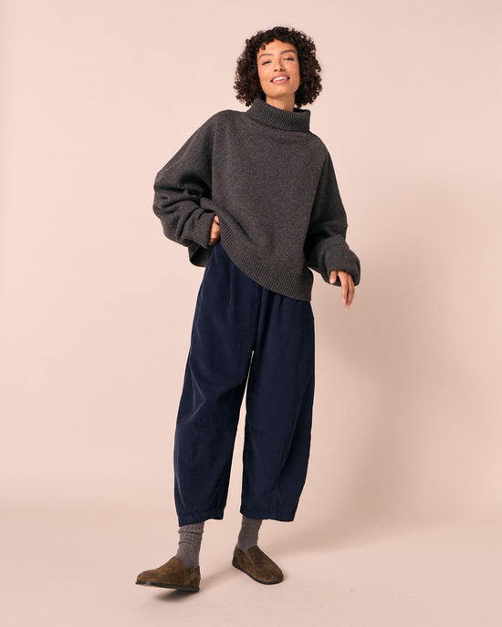 model wears daisy navy cord trousers left