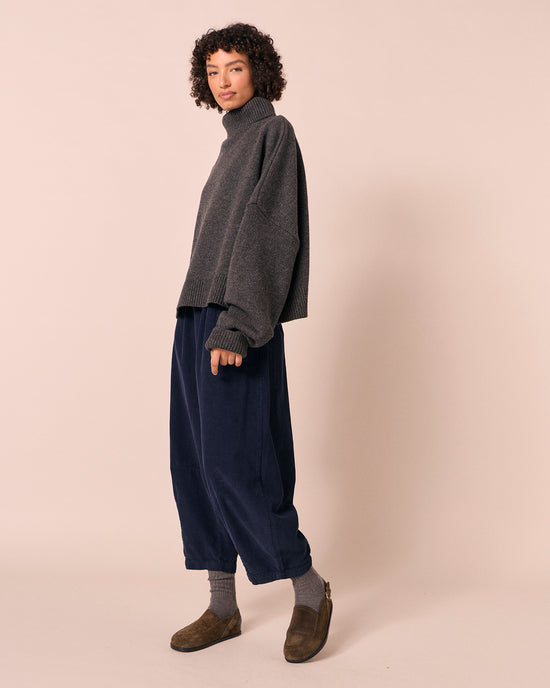 model wears daisy navy cord trousers right