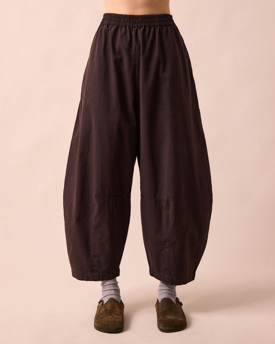 model wears daisy ganache textured cotton trousers front