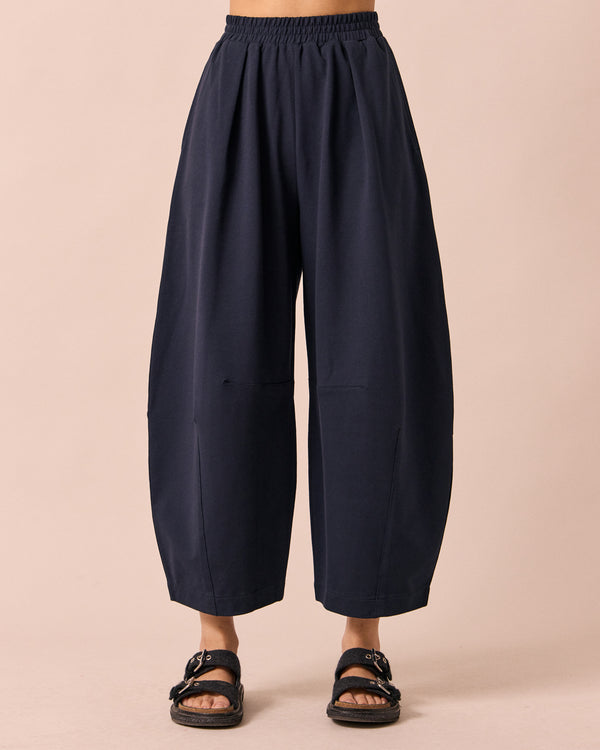 model wears daisy ink jersey trousers front