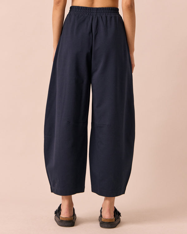model wears daisy ink jersey trousers back