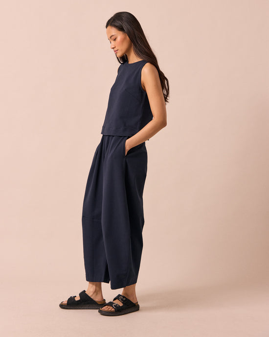 model wears daisy ink jersey trousers left