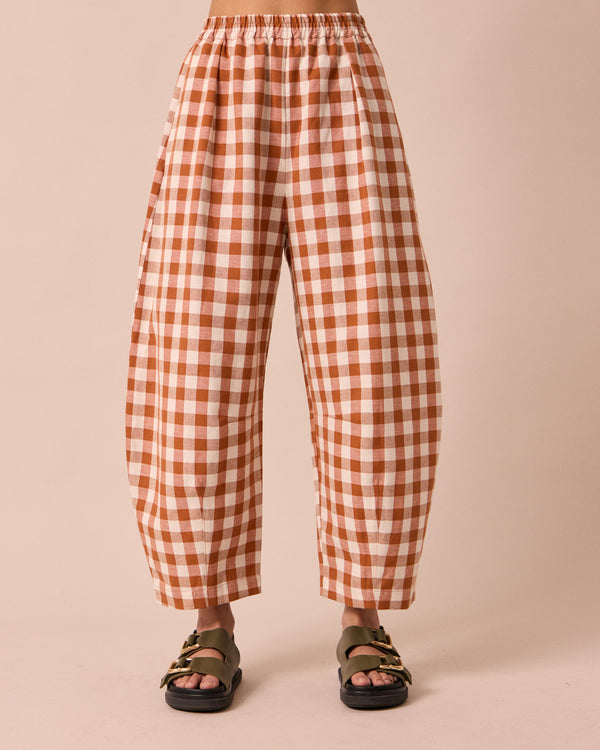 model wears daisy amber check cotton linen trousers front