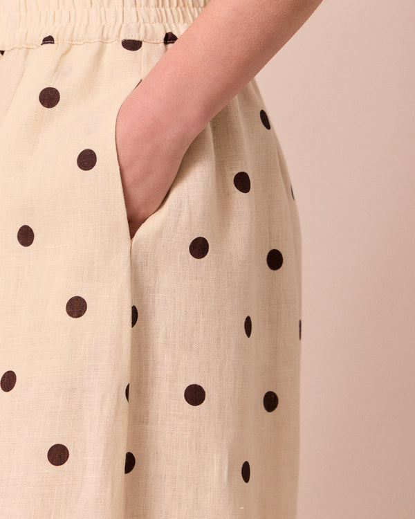 model wears daisy bone spot linen trousers 