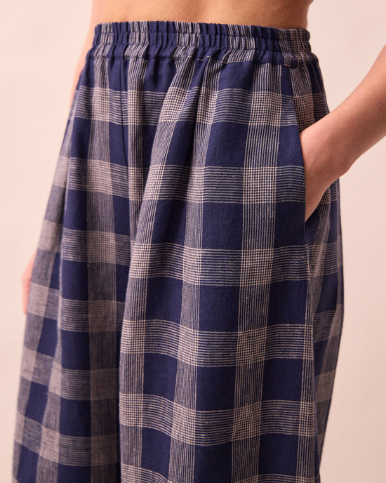 model wears daisy navy plaid linen trousers detail