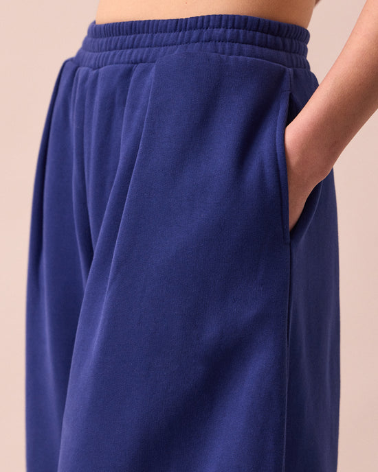 model wears daisy french blue fleeceback jersey trousers detail