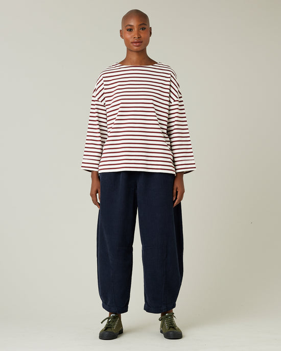 model wears navy cord daisy trousers