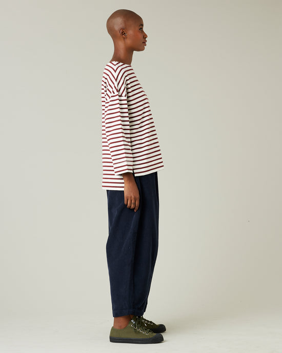 model wears navy cord daisy trousers