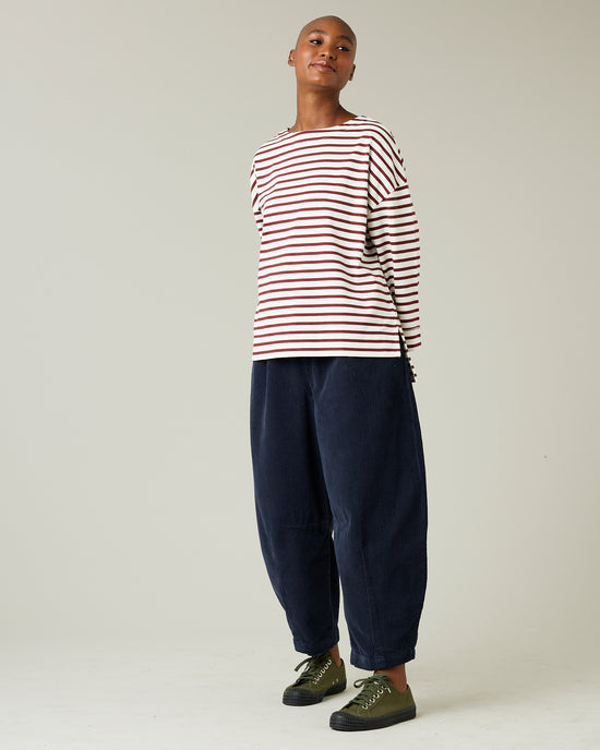 model wears navy cord daisy trousers