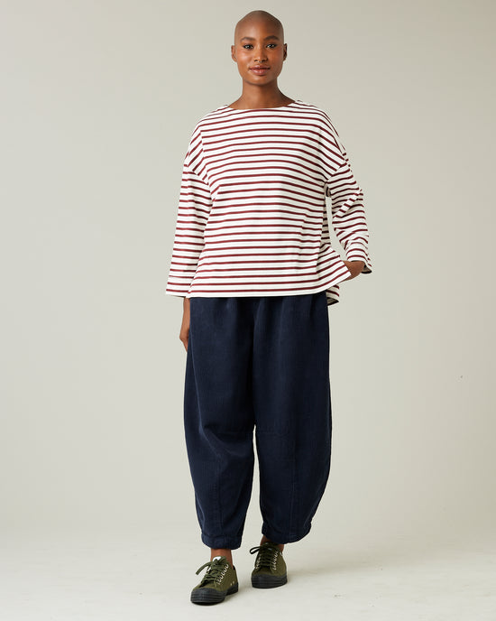 model wears navy cord daisy trousers