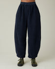 model wears navy cord daisy trousers front