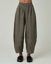 model wears coffee gingham daisy trousers front