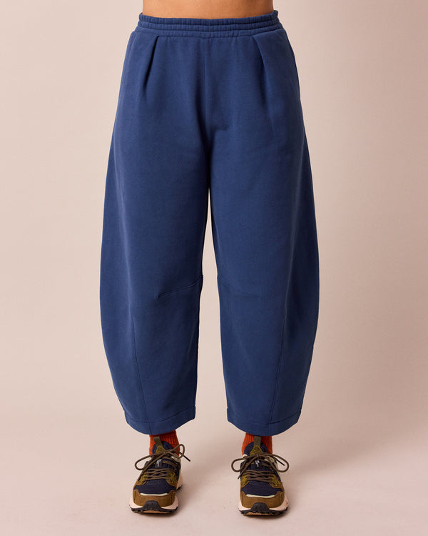 model wears french navy daisy fleeceback jersey trousers front
