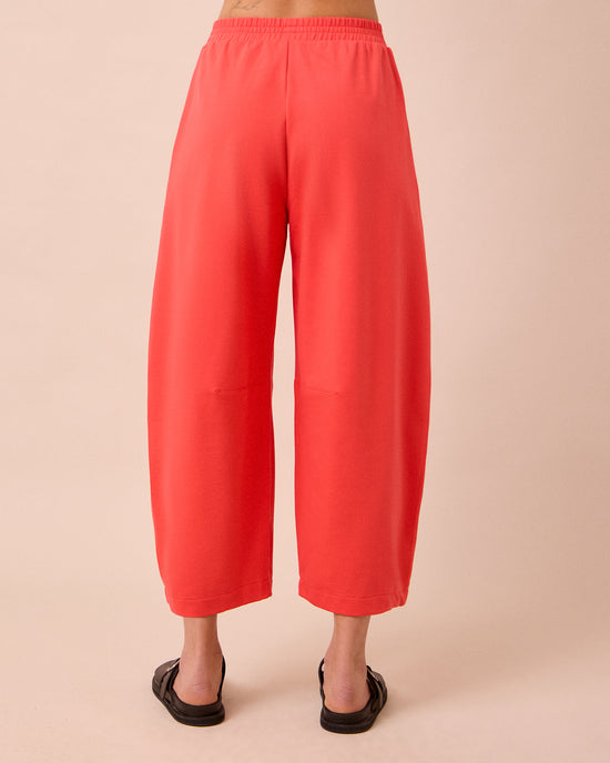 model wears daisy watermelon jersey trousers back