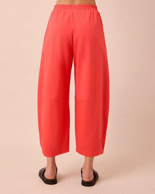 model wears daisy watermelon jersey trousers back