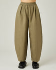 model wears light khaki linen daisy trousers front