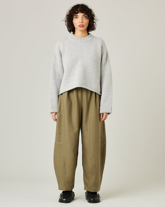 model wears light khaki linen daisy trousers 