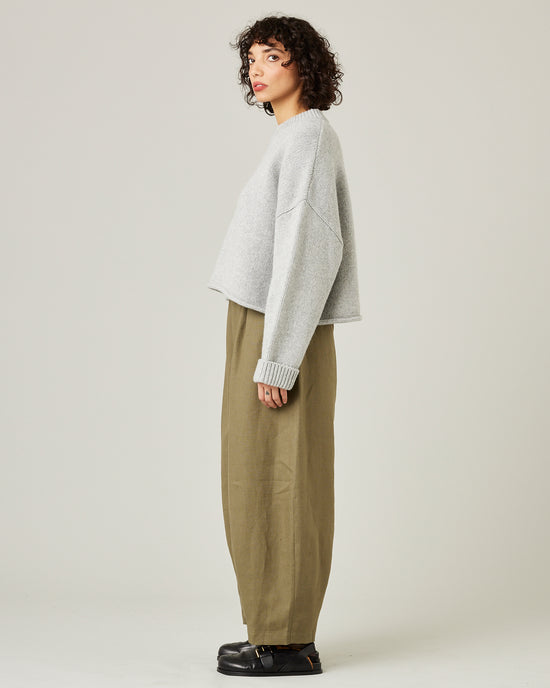 model wears light khaki linen daisy trousers 