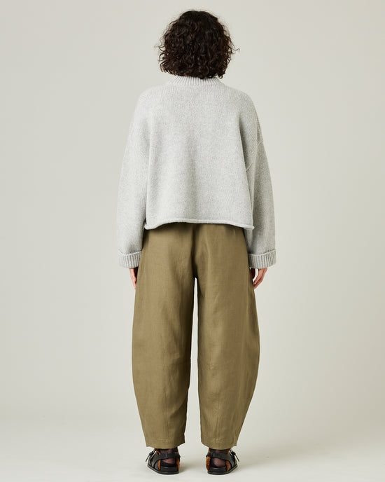 model wears light khaki linen daisy trousers 