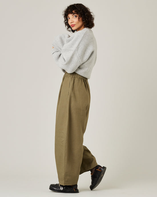 model wears light khaki linen daisy trousers 