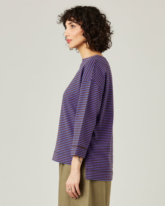 model wears blue and brown stripe breton top 